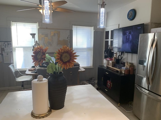 kitchen with ceiling fan and stainless steel fridge