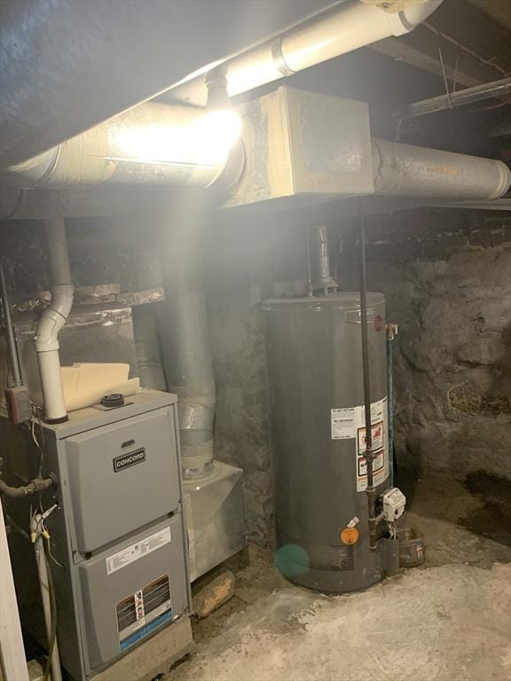 utility room featuring gas water heater