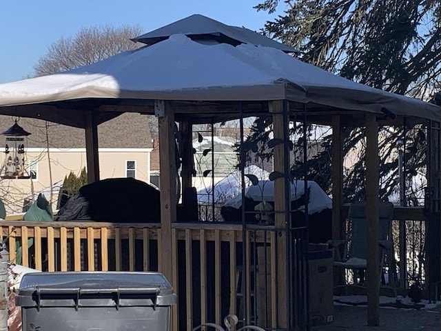 snow covered patio featuring a gazebo