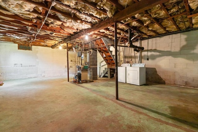 14 Farrell St, Newburyport, MA 01950 - unfinished basement featuring washing machine and clothes dryer, a heating unit, stairs, and concrete block wall