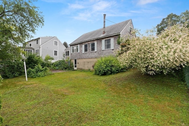 14 Farrell St, Newburyport, MA 01950 - rear view of property featuring a yard