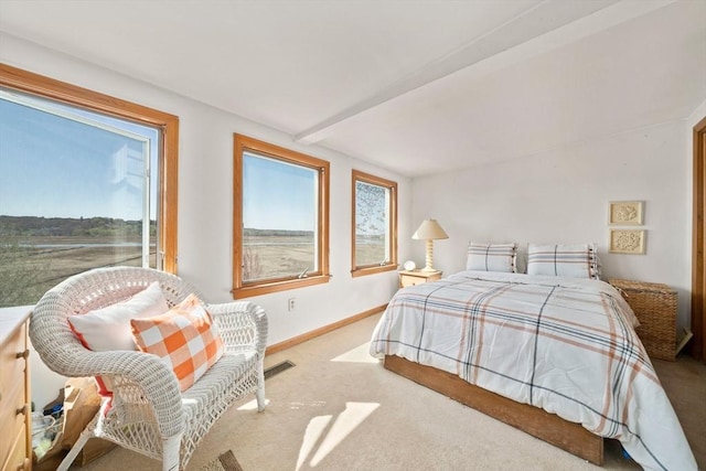 carpeted bedroom featuring baseboards