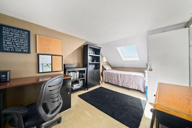 bedroom featuring vaulted ceiling with skylight and carpet