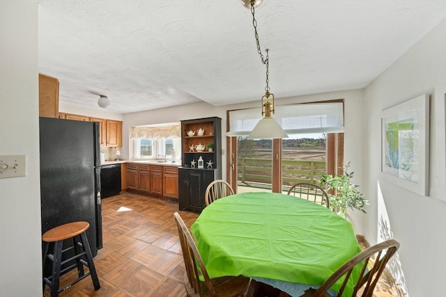 dining area with a textured ceiling