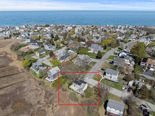 bird's eye view featuring a residential view and a water view