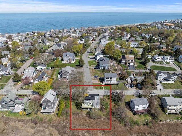 birds eye view of property featuring a water view and a residential view
