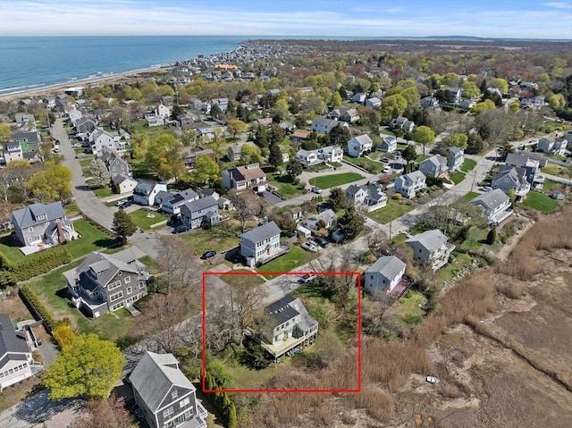 drone / aerial view with a residential view and a water view