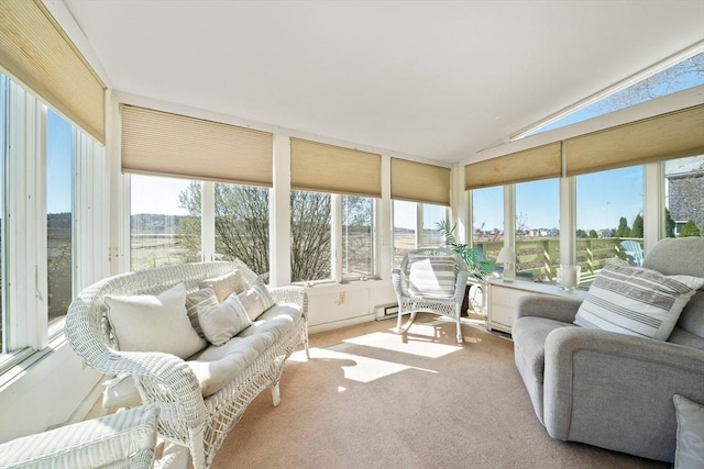 sunroom featuring carpet floors and lofted ceiling