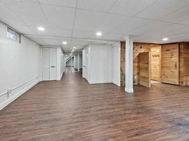 basement with dark hardwood / wood-style floors