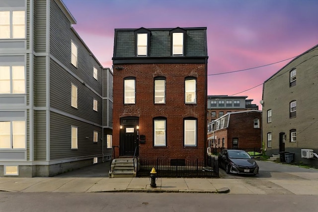 874 E 2nd St, Boston, MA 02127 - view of front of property featuring brick siding and mansard roof