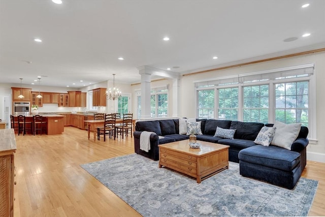 3 Aaron Rd, Lexington, MA 02421 - living area with recessed lighting, light wood-type flooring, a chandelier, and crown molding