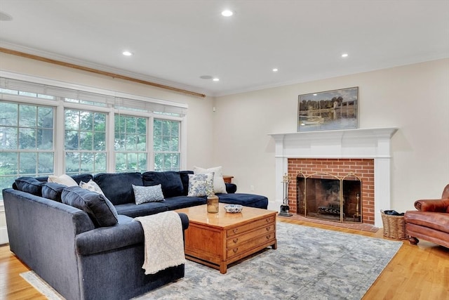 3 Aaron Rd, Lexington, MA 02421 - living room with ornamental molding, wood finished floors, recessed lighting, and a brick fireplace