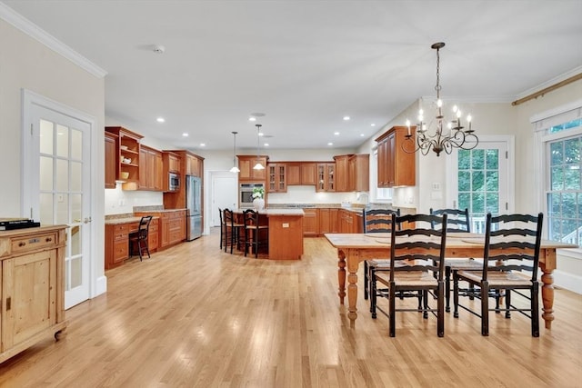 3 Aaron Rd, Lexington, MA 02421 - dining room with light wood-style floors, ornamental molding, a chandelier, built in desk, and recessed lighting