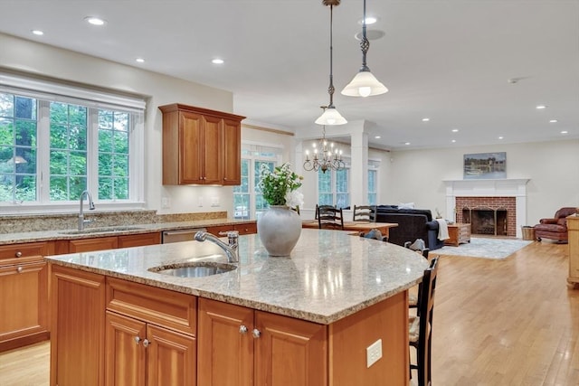 3 Aaron Rd, Lexington, MA 02421 - kitchen featuring plenty of natural light, light wood-style flooring, an island with sink, light stone countertops, and recessed lighting