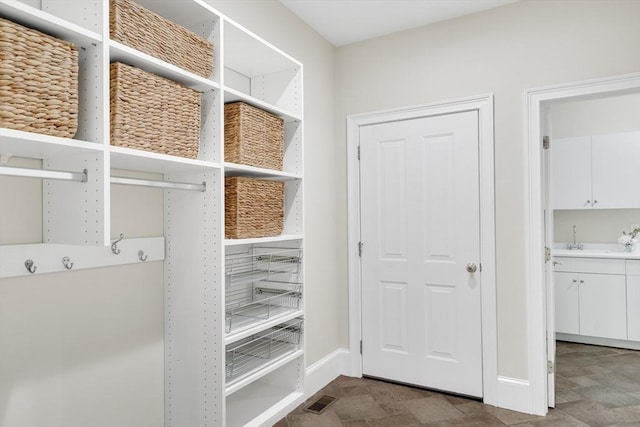 3 Aaron Rd, Lexington, MA 02421 - mudroom with baseboards and a sink