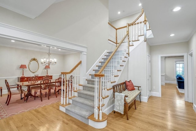 3 Aaron Rd, Lexington, MA 02421 - stairs with wood finished floors, a chandelier, ornamental molding, and recessed lighting