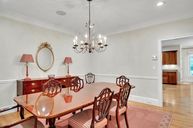 3 Aaron Rd, Lexington, MA 02421 - dining room with light wood finished floors, ornamental molding, and a chandelier