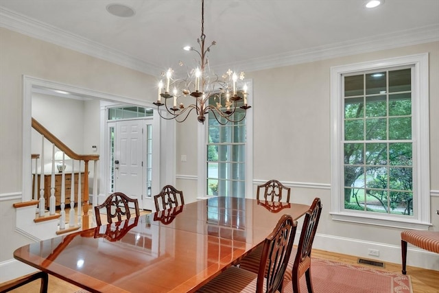3 Aaron Rd, Lexington, MA 02421 - dining room with ornamental molding, a chandelier, wood finished floors, stairs, and recessed lighting