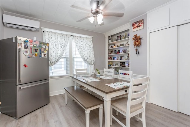 dining room featuring light wood finished floors, a wall unit AC, a ceiling fan, and crown molding