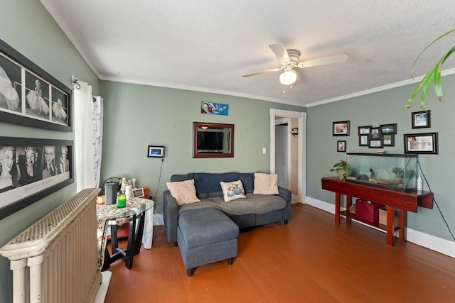 living area with baseboards, crown molding, a ceiling fan, radiator, and wood finished floors