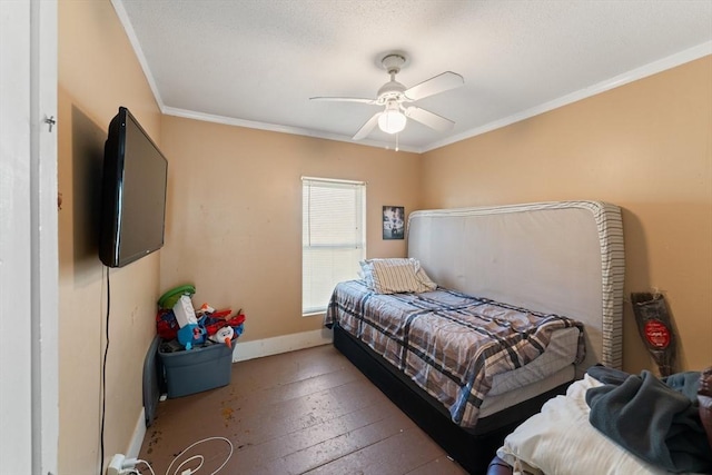 bedroom featuring a ceiling fan, baseboards, and ornamental molding