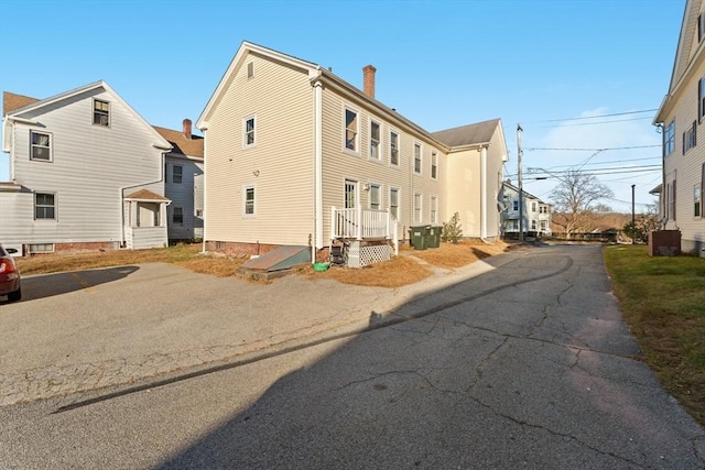 view of home's exterior featuring aphalt driveway