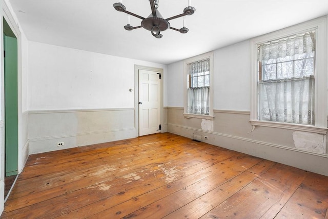 unfurnished room featuring hardwood / wood-style floors