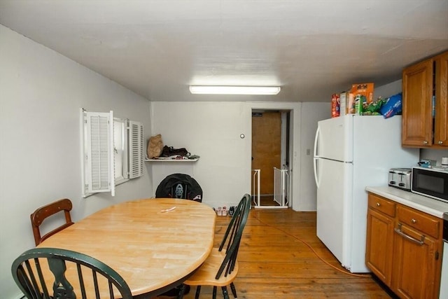 dining room featuring wood-type flooring