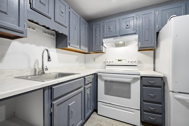 kitchen with gray cabinetry, sink, and white appliances