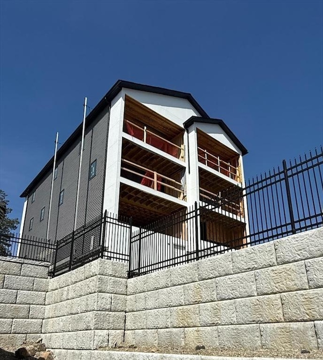 view of property exterior featuring fence