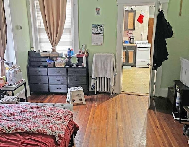 125-129 Arlington St, Chelsea, MA 02150 - bedroom featuring hardwood / wood-style floors and radiator
