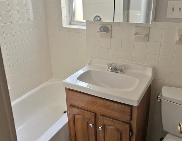 125-129 Arlington St, Chelsea, MA 02150 - full bath with vanity, tile walls, a tub, and toilet