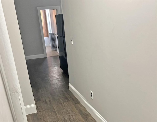 125-129 Arlington St, Chelsea, MA 02150 - hallway featuring radiator, baseboards, and dark wood-style floors