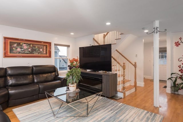 living room with light hardwood / wood-style flooring