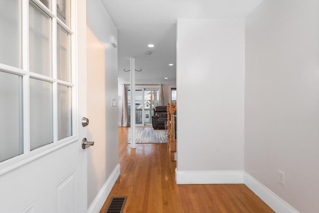 corridor featuring hardwood / wood-style flooring