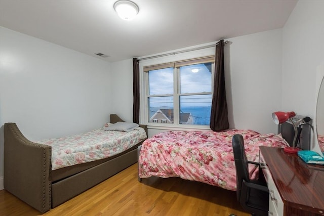 bedroom with hardwood / wood-style floors