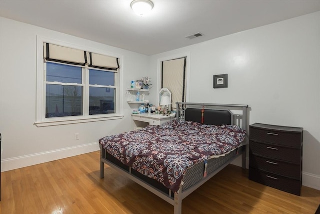 bedroom featuring light wood-type flooring