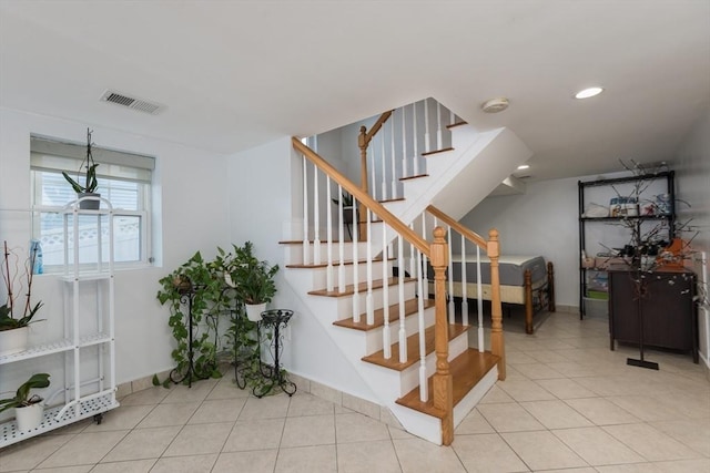 staircase with tile patterned floors