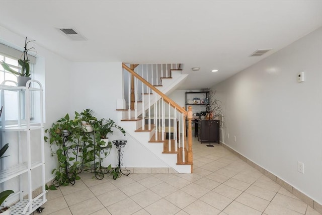 stairs featuring tile patterned floors