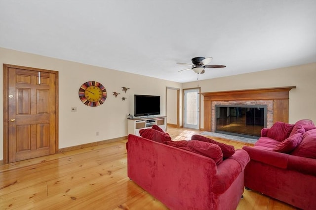 living room with ceiling fan and wood-type flooring