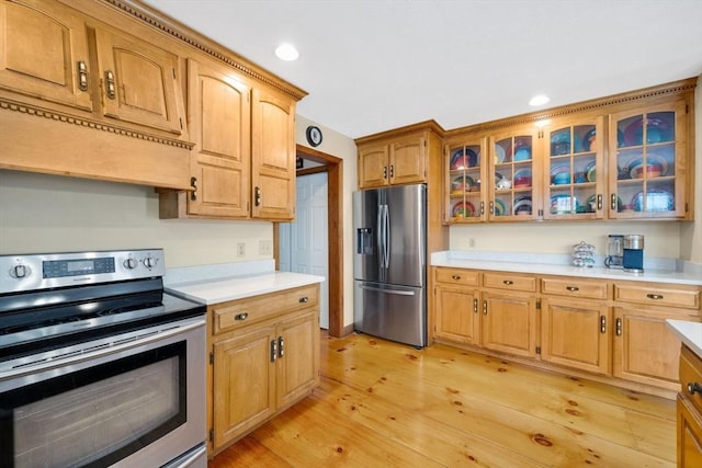 kitchen with light hardwood / wood-style floors and stainless steel appliances