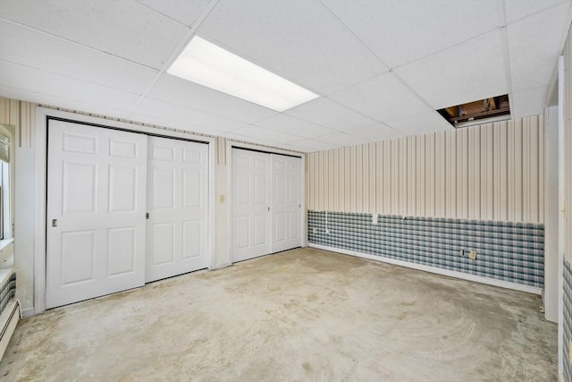 basement featuring a paneled ceiling