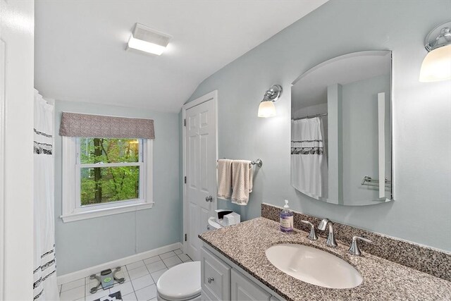 full bath featuring vaulted ceiling, toilet, vanity, tile patterned floors, and baseboards