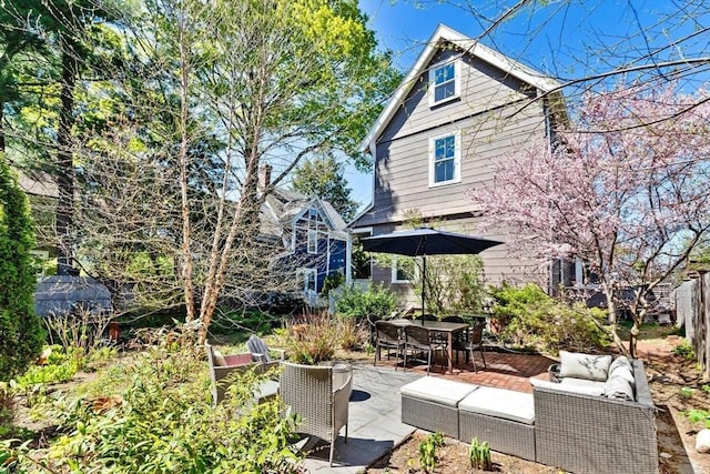 view of patio / terrace featuring outdoor lounge area, fence, and outdoor dining space