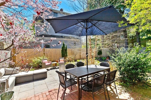 view of patio / terrace featuring outdoor dining area and a fenced backyard