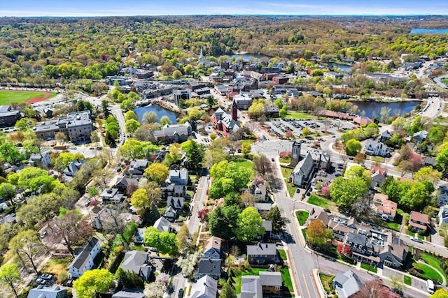 drone / aerial view with a water view and a residential view