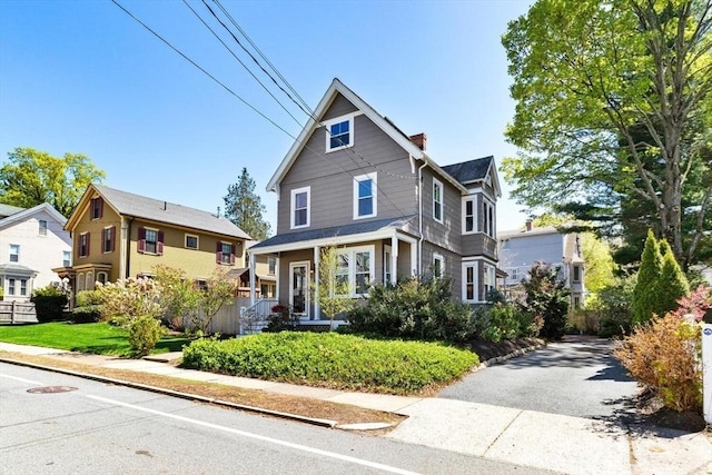 view of front of home featuring a chimney