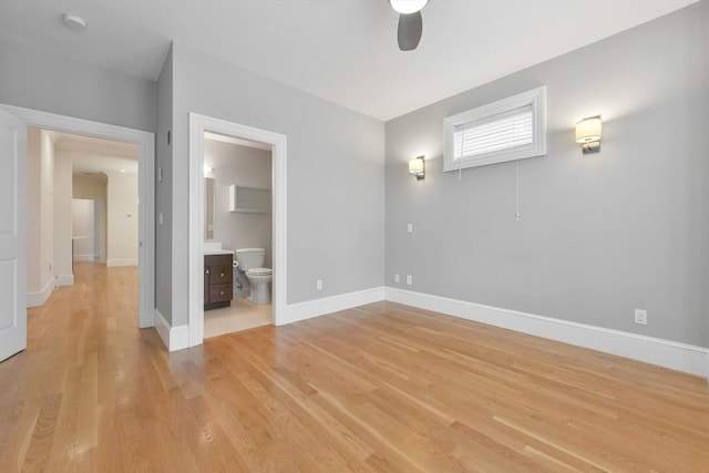 870 E 4th St Unit 1, Boston, MA 02127 - unfurnished bedroom with light wood-type flooring, connected bathroom, and a ceiling fan