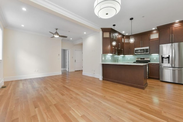 870 E 4th St Unit 1, Boston, MA 02127 - kitchen with stainless steel appliances, crown molding, backsplash, light countertops, and glass insert cabinets