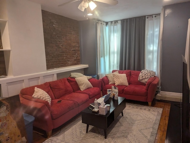 living room with wood-type flooring and ceiling fan